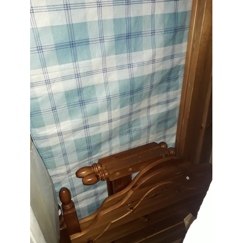 484 - A pine single bed frame with chequed matress