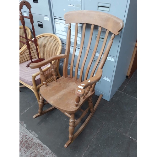 592 - A light wood rocking chair