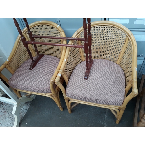 593 - A pair of cane tub chairs