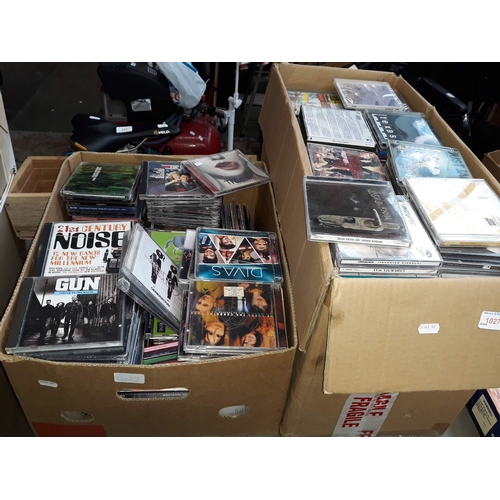 1027 - 2 large boxes of various CDs and a wooden tray