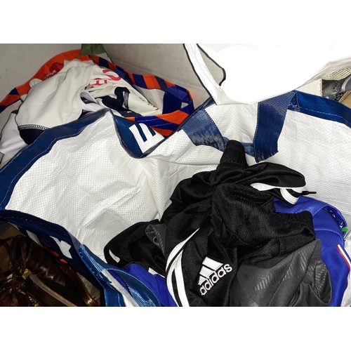 219 - 2 bags of football shirts - quantity 24 shirts and a pair of shorts