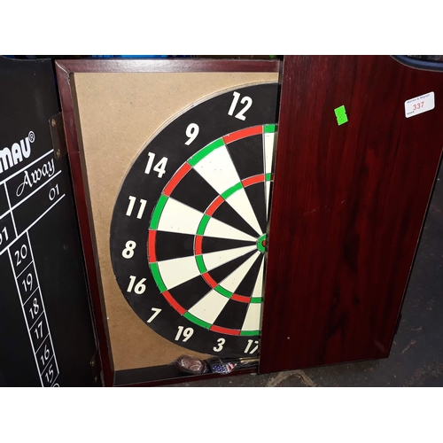 337 - A darts board with darts