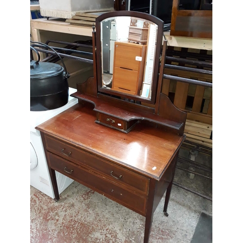 606 - An Edwardian inlaid dressing table