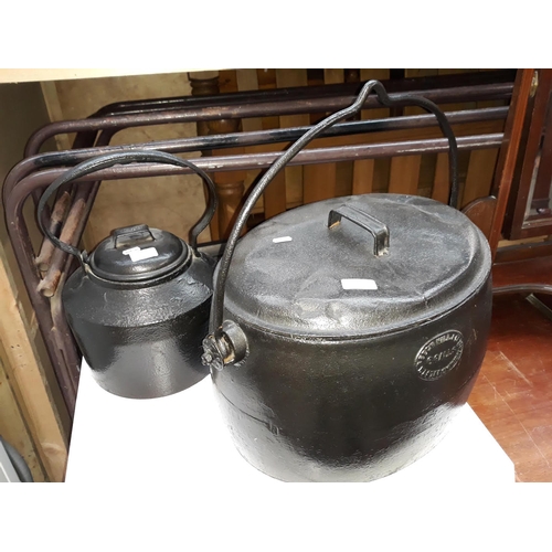 607 - A large 6 Gal. cast metal cooking pot by Beech Hill & Co. and a cast metal kettle