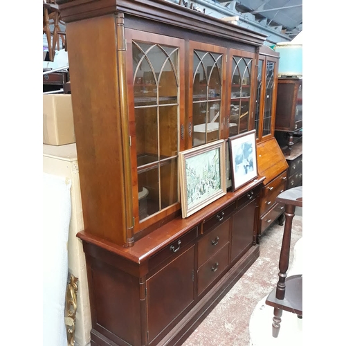 643 - A reproduction cabinet bookcase.