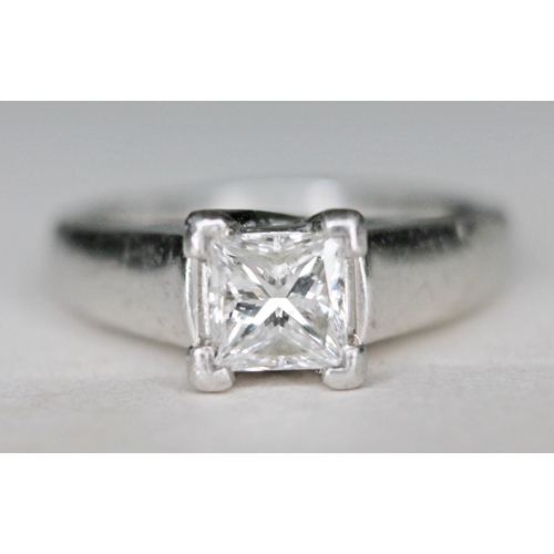 133 - A diamond solitaire ring, the princess cut stone approx. 0.78 carats, band with foreign platinum mar... 