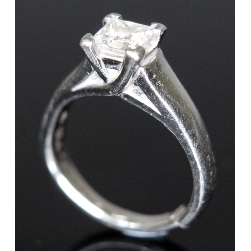 133 - A diamond solitaire ring, the princess cut stone approx. 0.78 carats, band with foreign platinum mar... 