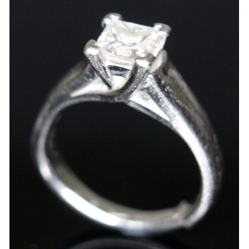 133 - A diamond solitaire ring, the princess cut stone approx. 0.78 carats, band with foreign platinum mar... 