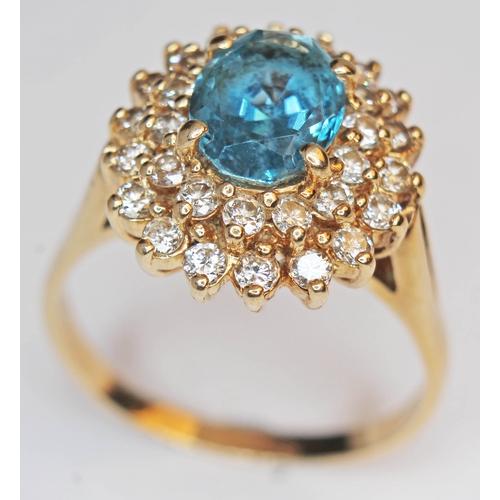 174 - A blue topaz and diamond cluster ring, the band marked '14K, gross weight 6.4g, size T.