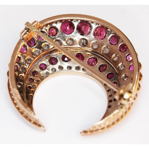 175 - A ruby and diamond crescent brooch, unmarked, gross weight 9.6g, diam. 33mm.