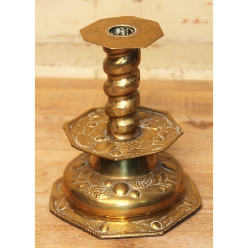 283 - A 17th/18th century Swedish brass candlestick embossed with fruit, height 18.5cm.