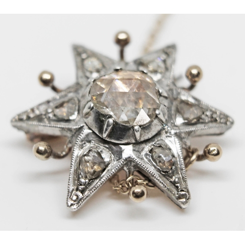 222 - A 19th century diamond cluster star brooch featuring a central rose cut diamond, diameter approx. 7m... 