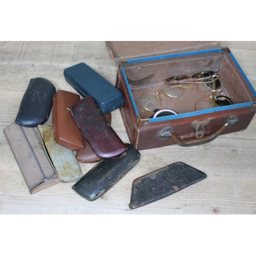 396 - A quantity of vintage spectacles and sunglasses in a small case..