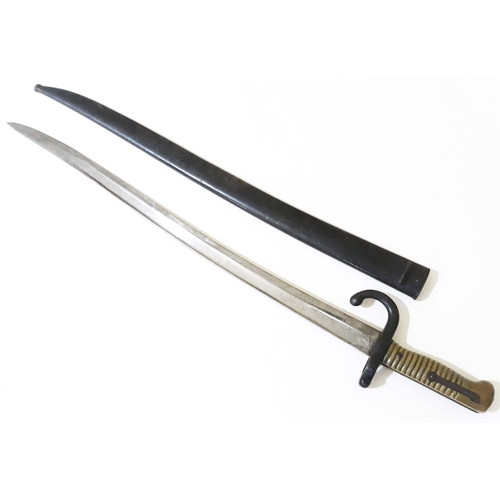 427 - A French bayonet and scabbard, length 71cm.