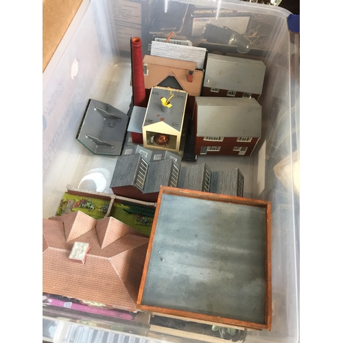 148 - A box of railway pieces to include sheds and houses