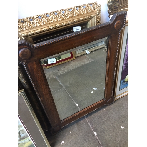 989 - An oak framed mirror