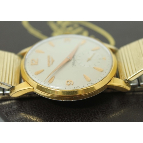 101 - A 1960s Longines Flagship gold plated gent's wristwatch, ref 6842-1, the silvered dial having gold f... 