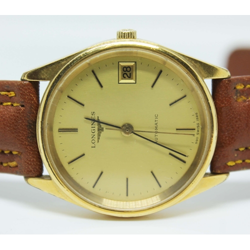 102 - A unisex Longines 1980s automatic datejust gold plated wristwatch, ref 1626-3, the signed gold colou... 