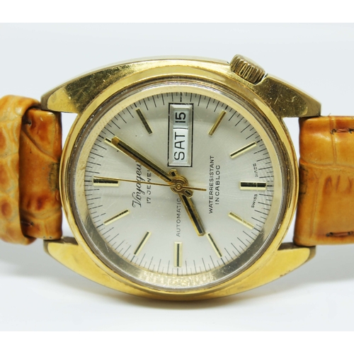 110 - A gent's Voyageur automatic gold tone stainless steel wristwatch on leather strap, the silvered dial... 