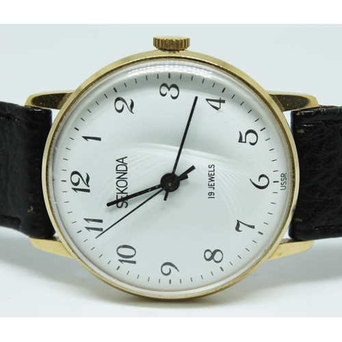 123 - A Sekonda gold plated mechanical manual wind wristwatch with signed white dial, black  Arabic numera... 