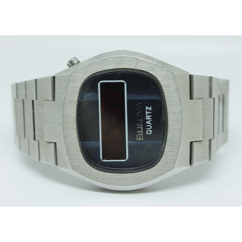 127 - A vintage Bulova quartz stainless steel wristwatch with retro digital display on stainless steel fol... 