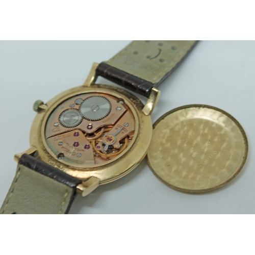 142 - A gents 9ct gold Omega watch, ref 16438959, calibre 510 movement, dial with gold makers/hands and se... 