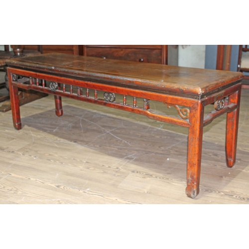 64 - A Chinese 19th century hardwood bench seat with spindle and pierced frieze, length 164cm, depth 47cm... 