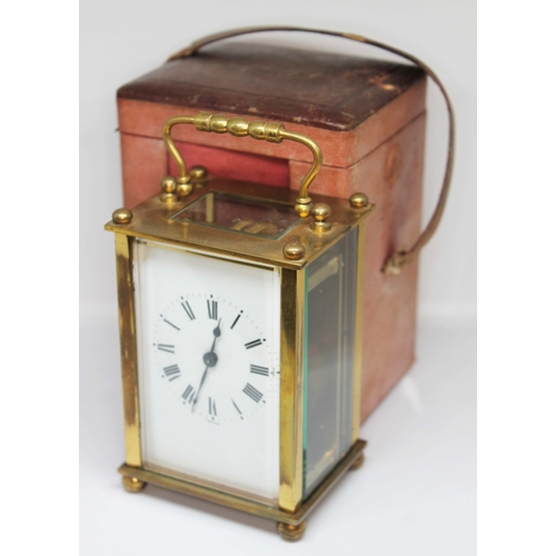 73 - A four glass brass carriage clock, the dial with Roman numerals and inscribed 'France', height 14cm,... 