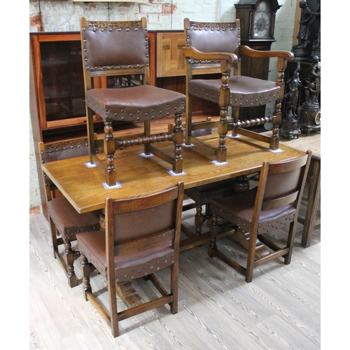 86 - An aged oak refectory table and six studded chairs, table length 168cm, depth 75cm & height 78.5cm.