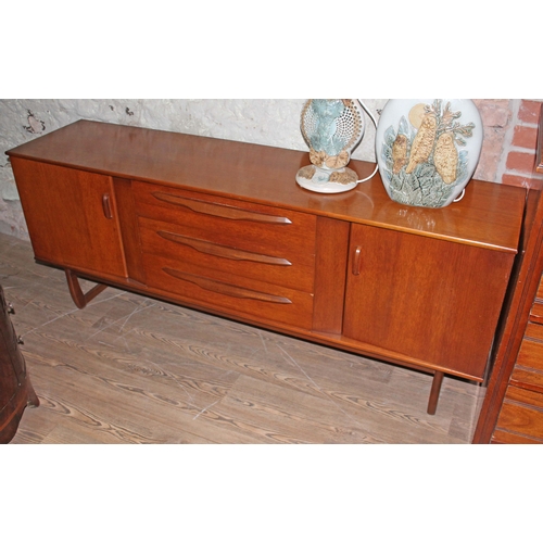 85 - A retro teak sideboard, length 183cm.