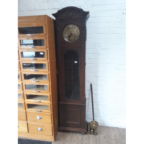 89 - An oak long case clock circa 1930, brass dial with Gothic numerals, three weight driven movement, he... 