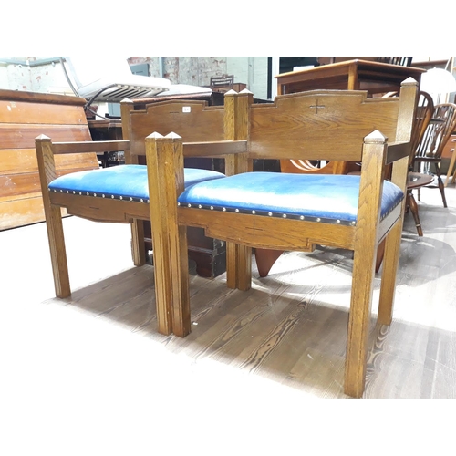 90A - A pair of oak church chairs.