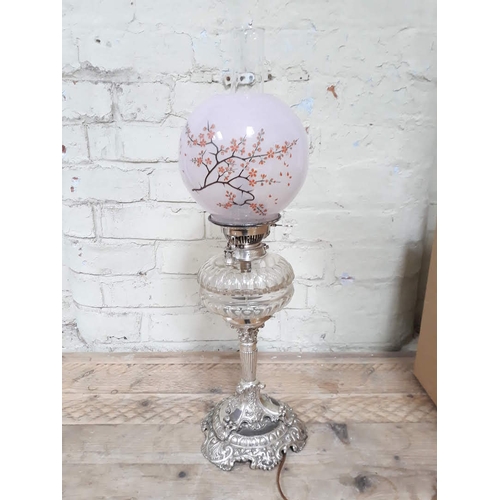 90D - An Evered & Co silver plated oil lamp (converted to electric), with cut glass reservoir and pink gla... 