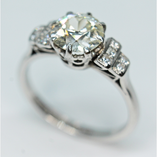 100 - A diamond solitaire ring by Boodle and Dunthorne, the central diamond approx. 1.40 carats, diamond s... 