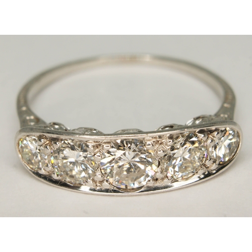 104 - An Art Deco style five stone diamond ring, total approx. diamond wt. 1.46 carats, white metal band u... 