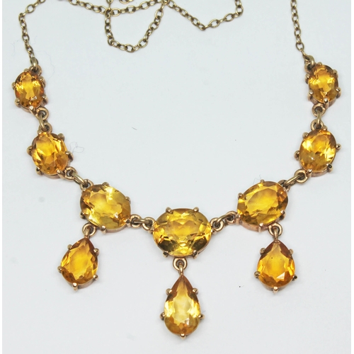 109 - A 9ct gold drop pendant necklace featuring 10 yellow stones, hallmarked 9ct gold, gross wt. 8g, leng... 