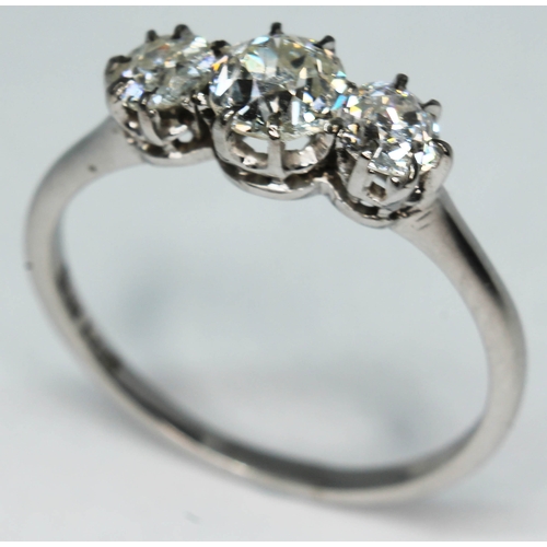 119 - A three stone diamond ring, total approx. diamond wt. 0.95 carats, band marked 'W18ct', gross wt. 2.... 