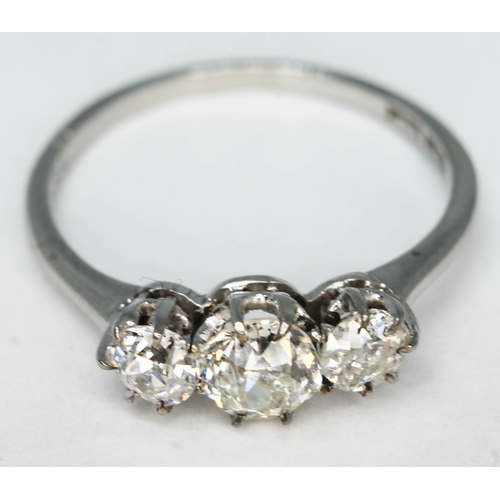 119 - A three stone diamond ring, total approx. diamond wt. 0.95 carats, band marked 'W18ct', gross wt. 2.... 