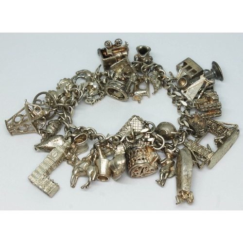 120 - A hallmarked silver charm bracelet., length 15cm, wt. 97.7g.