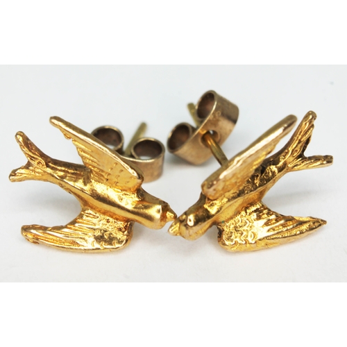 121 - A pair of 9ct gold stud earrings formed as swallows, 9ct gold hallmarks, length 13mm, wt. 3.1g.