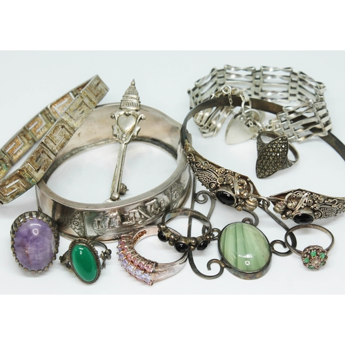 126 - A mixed lot of hallmarked and other silver comprising two bangles, two bracelets, an Arts & Crafts s... 