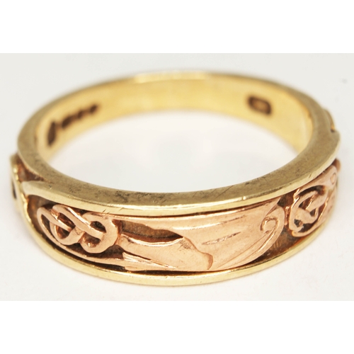 137 - A hallmarked 9ct gold with Celtic style design, wt. 6.9g, size V.