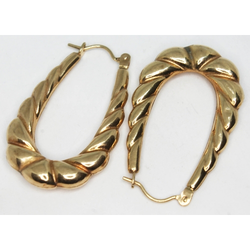 142 - A pair of 9ct gold earrings, marked '9ct', length 32mm each, wt. 1.7g.