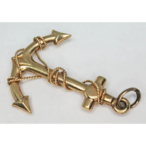 164 - A 9ct gold pendant formed as an anchor, marked '375', length 37mm, wt. 1.8g.