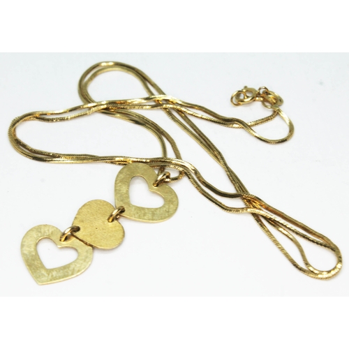 167 - A 9ct gold three hearts drop pendant on chain, marked '375' and also with import marks, chain length... 