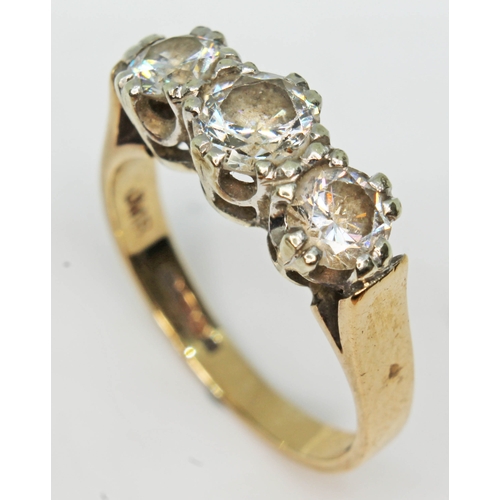 183 - A hallmarked 9ct gold ring set with three cubic zirconia, gross wt. 3.9g, size M.