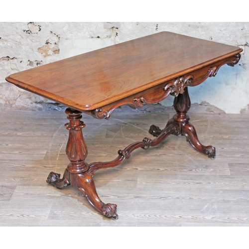 6 - A 19th century rosewood writing table having moulded scroll frieze, pedestal legs supported by scrol... 