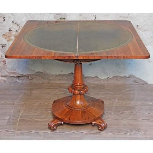 7 - A William IV rosewood fold over card table, tooled leather interior, turned pedestal with round plat... 