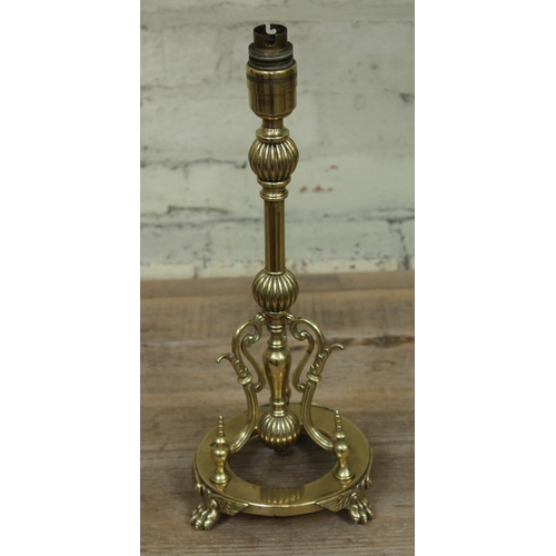 462 - A brass lamp base in the manner of Christopher Dresser, height 41cm.