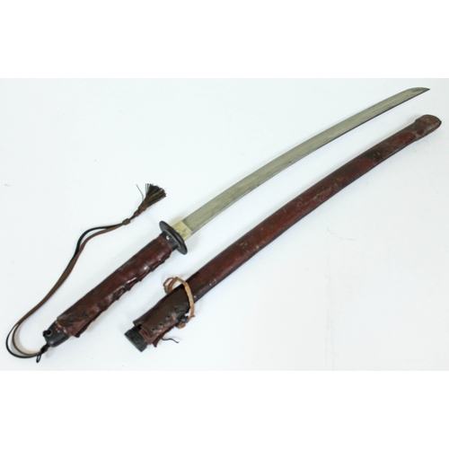 468 - A Japanese WWII officer's katana with bound fish skin grip black lacquered scabbard and leather cove... 